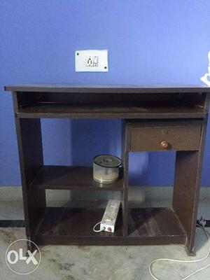 Wooden compute table in genuine condition. it