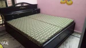 Wooden double bed with storage.