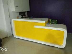 Yellow And White Wooden Reception Desk