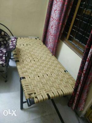 Beige Woven Folding Bed With Black Frame