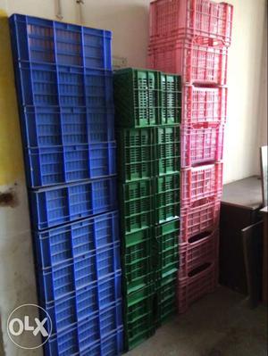 Blue, Red, And Green Plastic Bottle Crates