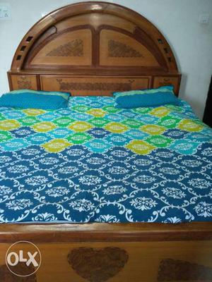 Blue, White, And Yellow Floral Bedspread With Two Pillows
