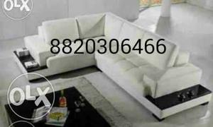 Brand new white sectional sofa along sofa side table