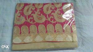 Folded Pink And Gold-colored Cloth In Pack