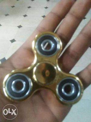Gold-colored Tri-spinner Fidget Toy