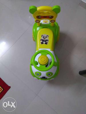 Toddler's Green, Yellow, And White Plastic Ride-on Toy Car