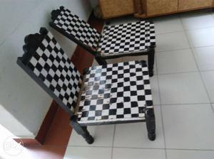 Two Black-and-white Checked Wooden Armless Chairs