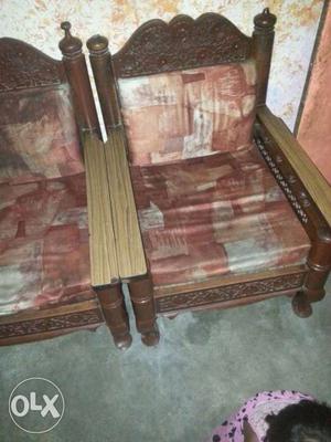 Two Brown Wooden Framed Padded Armchairs