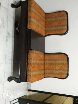 Two seater setty made of sagwaan wood.