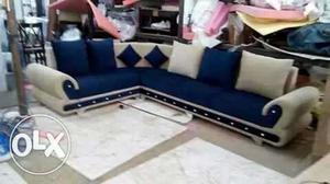 White And Blue Sectional Couch With Throw Pillows