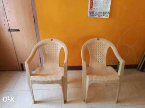 2 Beige Plastic Armchairs