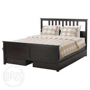 Black Wooden Bed Frame And White And Gray Plaid Bedspread