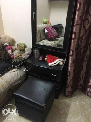 Black Wooden Dresser With Mirror and puffy