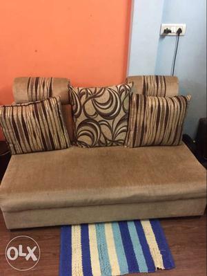 Brown Cushion Couch With Throw Pillows