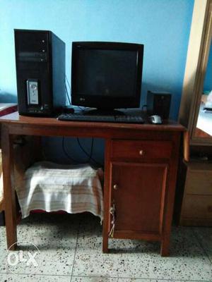 Brown Wooden Computer Desk With Black Computer Set