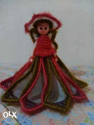 Doll In Red And Green Dress]