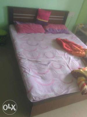 Queen size bed with mattress and 2 pillow