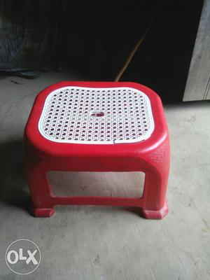 Red And White Plastic Floor Seat