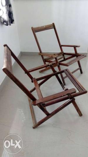 Two Brown Wooden Frame Chairs