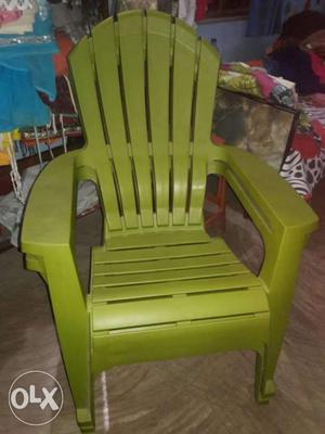 Two Green Plastic Armchairs