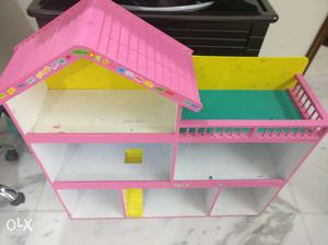 White And Pink Wooden Doll House