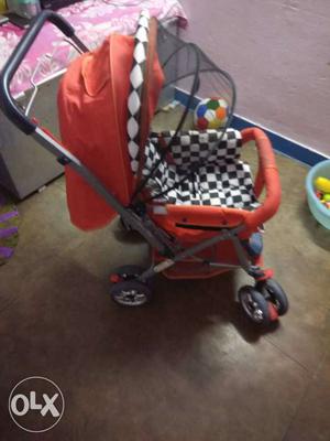 Baby's Orange Black And White Checked Stroller