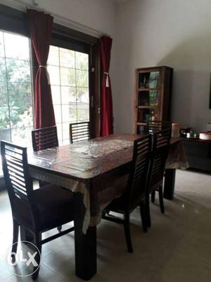 Brown Wooden Dining Table With Chairs