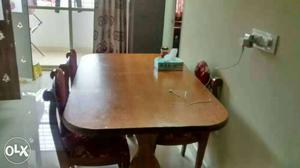 Dining table with four chairs good quality wood.