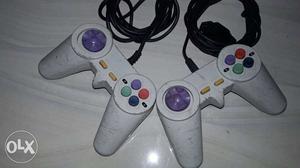 Pair Of White Corded Gaming Controllers