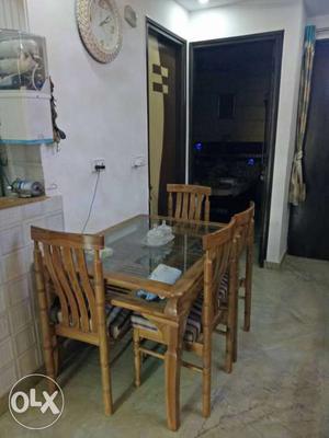 Pure teak wood showroom condition with 4 chairs