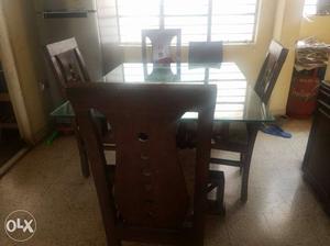 Rectangular Brown Wooden Table With Four Chairs Set