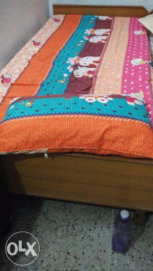 Single wooden bed is available