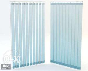 Two White Vertical Window Blinds