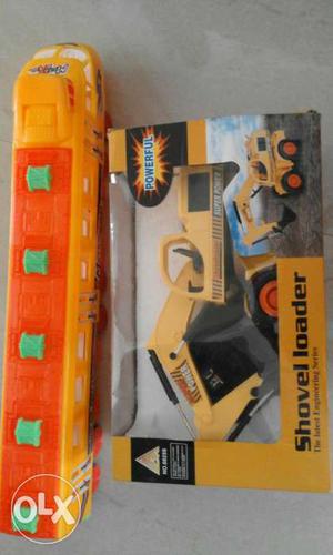 Yellow And Orange Shovel Loader Toy with train.
