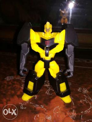 Yellow, Black And Gray Action Figure