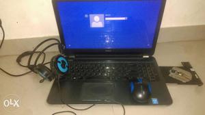 Black Dell Laptop With Mouse