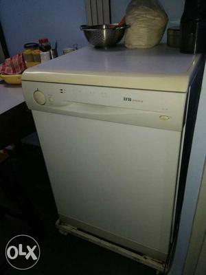 IFB Dishwasher with a stand and everything intact.