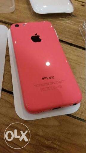 Ladies using phone IPhone 5c rose very nice