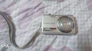 Silver Nikon Compact Camera