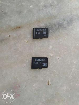 Two Black SanDisk 4GB And 8GB Micro SD Cards