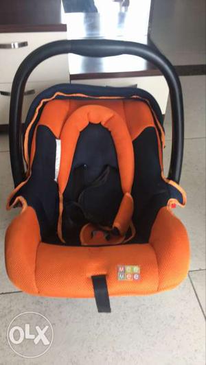 Baby car seat and rocker with adjustable straps.