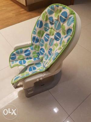 Baby's Green, Blue, And White Car Booster Seat