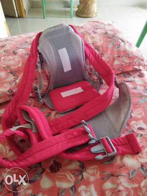 Baby's red And Gray Carrier
