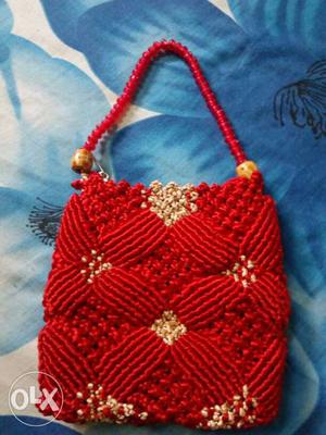 It's red hand made hand bag...