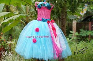 Nuwi 's La Boutique We design exotic frocks from