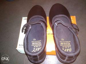 Pair Of Black Leather Mary Jane Flat Shoes