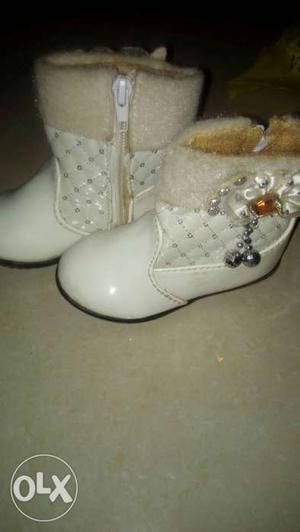 Pair Of White Leather Boots