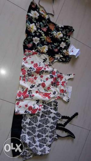Three Black,white And Red Floral Sleeveless Shirts in