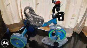 Toddler's Blue, Gray, And Green Trike Bicycle With Pack