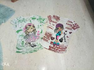 Two White, Green, And Red Girl Print Cap-sleeve Shirts